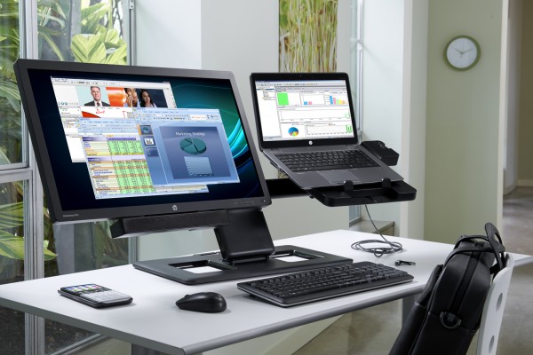 HP EliteBook 840 docked on HP Dual Hinge Display and Notebook Stand next to the HP EliteDisplay E271i